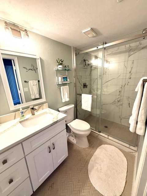 Bathroom with walk-in shower and vanity